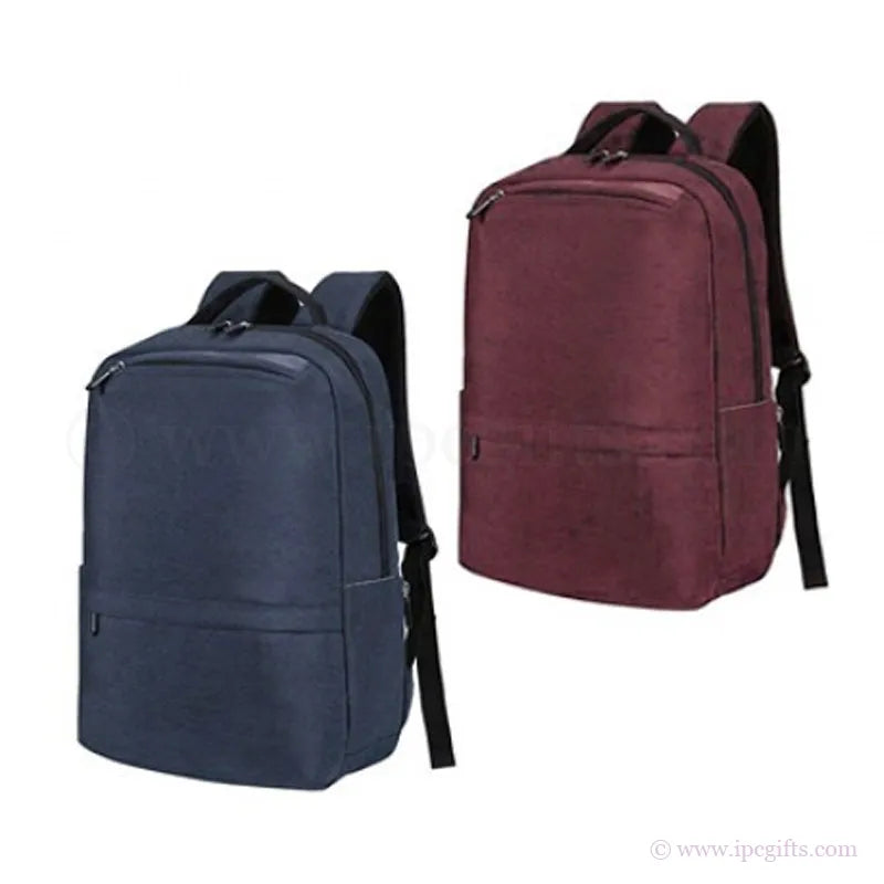 Two backpacks, one blue and one maroon, on a white background.
